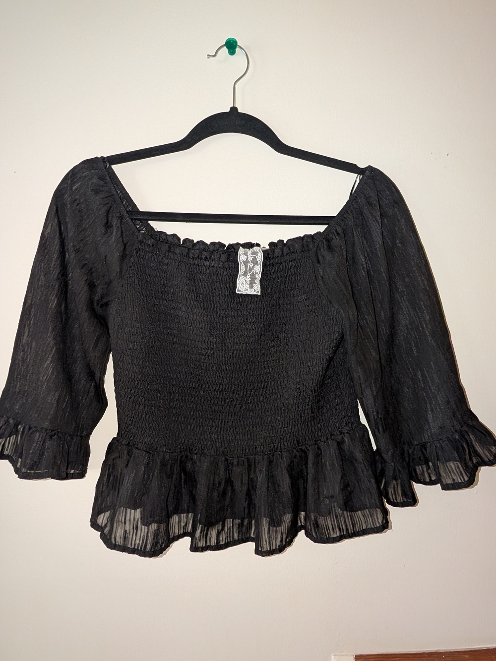 Sadie & Sage Black Smocked Peasant Top with Ruffled Hem